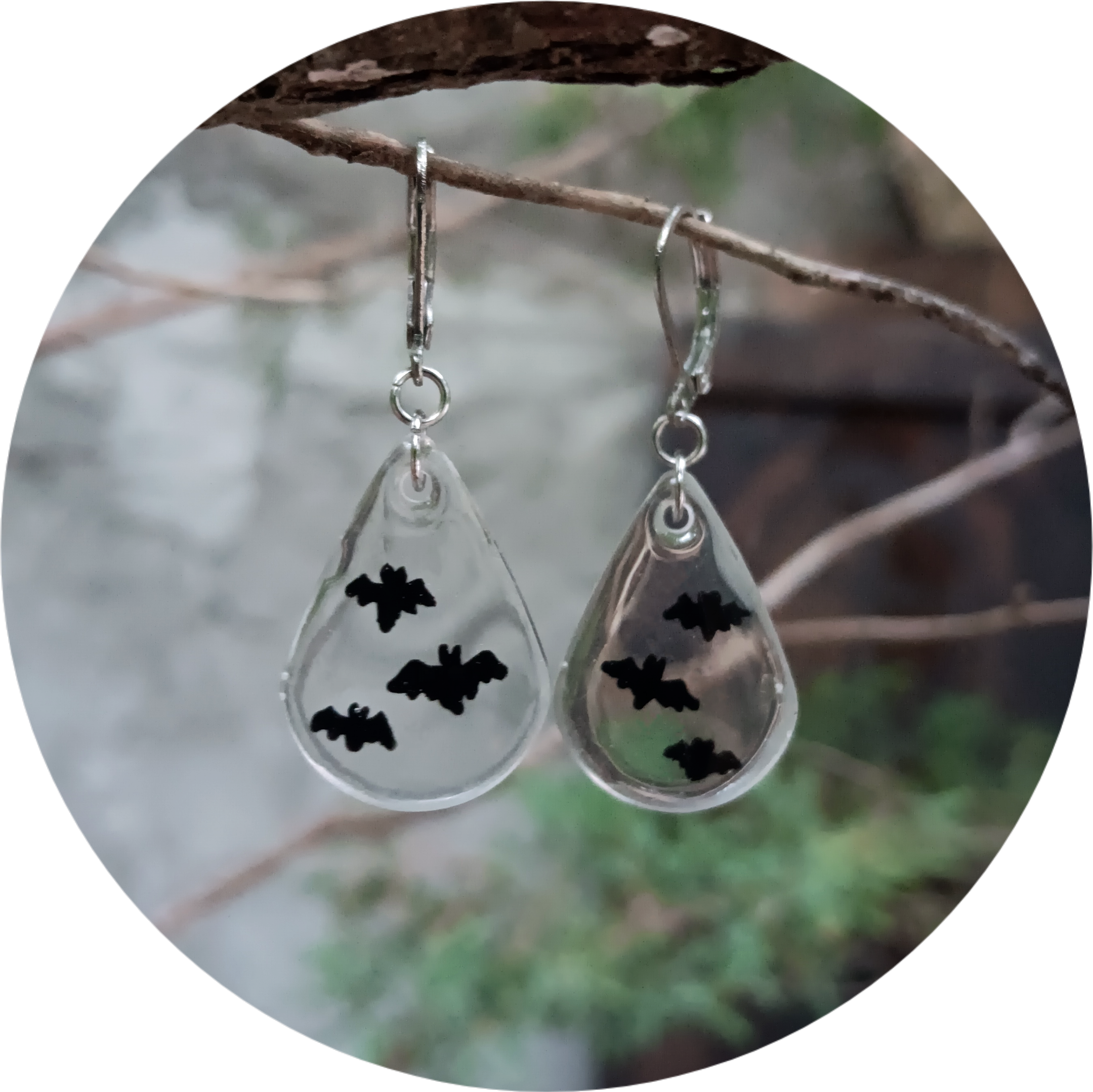 These spooky bat earrings, sold by captain memo deaigns, are quickly becoming a viral sensation in the alternative fashion community and stand out as a highly sought-after accessory for anyone obsessed with unique handmade jewelry. As one of our most popular statement pieces, this exquisite pair of gothic resin earrings features detailed hand painted black bat silhouettes suspended in crystal-clear, lightweight drops that capture the light perfectly, making them an incredibly trendy choice for everyday alternative outfits, edgy festival wear, or the ultimate Halloween costume accessory. This top-selling spooky jewelry style is currently in high demand and driving massive interest across fashion blogs, cementing its status as a must-have item for lovers of cottagegoth aesthetics, witchy vibes, and dark academia style. Customers are absolutely raving about this crowd-pleasing design, ensuring it remains a frequently requested favorite and a wildly popular gift idea for your favorite goth friend, nature enthusiast, or anyone who loves to collect statement-making novelty earrings. Because these clear resin bat dangles are a heavily trending item that everyone is trying to get their hands on right now, they offer the perfect blend of subtle spooky elegance and modern alternative style to elevate your jewelry collection before they completely sell out.